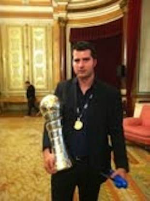 João Janeiro with trophies and medals across his coaching career